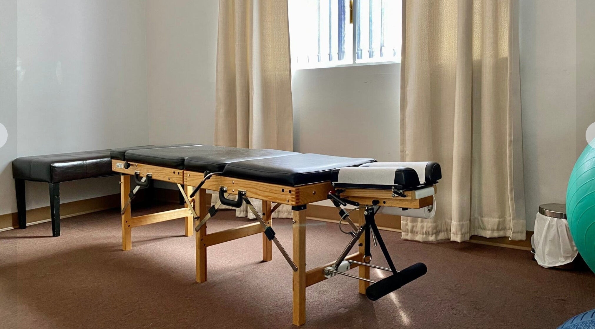 Massage therapy room at Bluebell Health, Winnipeg, Manitoba, CA with treatment table and natural light.