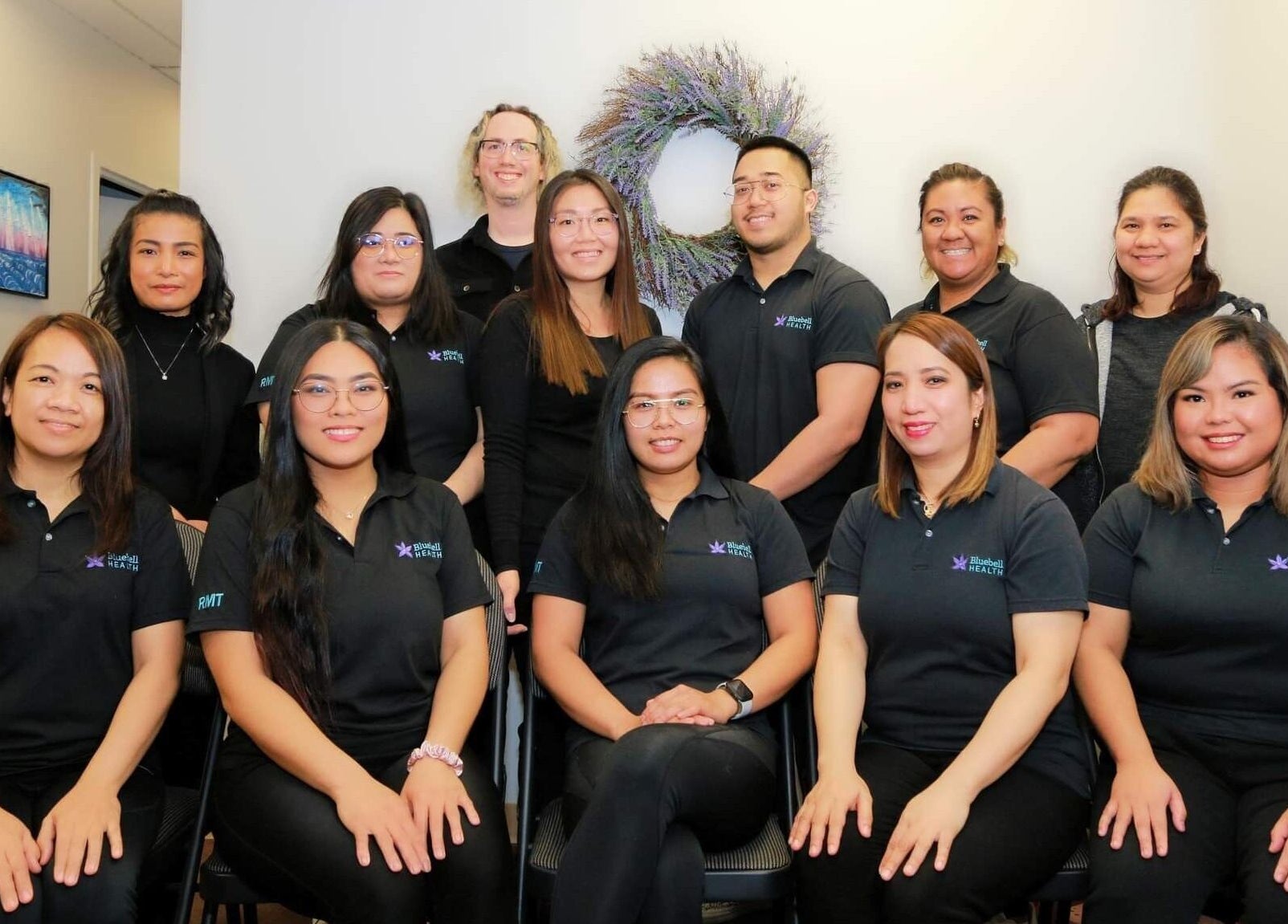 Bluebell Health team in Winnipeg, Manitoba, CA, gathered in professional attire.