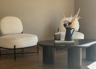 Chic waiting area at Steph Skelton Hair Studio, York, England, GB featuring elegant chairs and a stylish table.