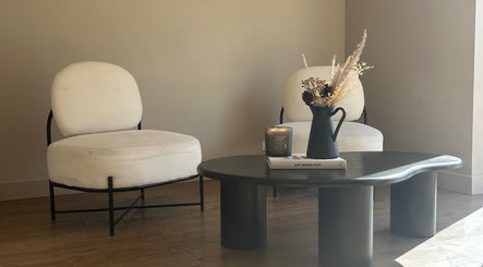 Chic waiting area at Steph Skelton Hair Studio, York, England, GB featuring elegant chairs and a stylish table.