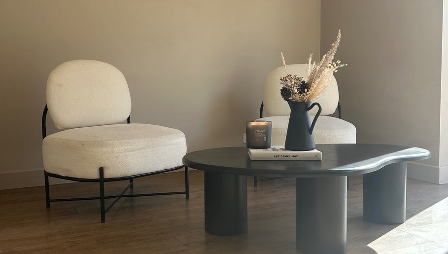 Elegant seating area at Steph Skelton Hair Studio, York, England, GB featuring stylish chairs and table.