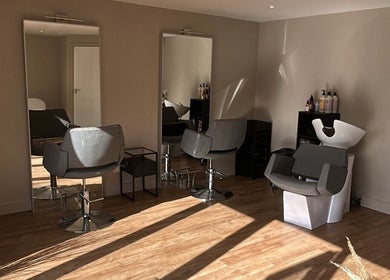 Modern salon chairs and mirrors at Steph Skelton Hair Studio in York, England, GB.
