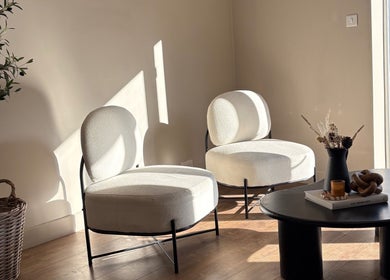 Modern lounge area in Steph Skelton Hair Studio, York, England, GB showcasing stylish chairs and a coffee table.