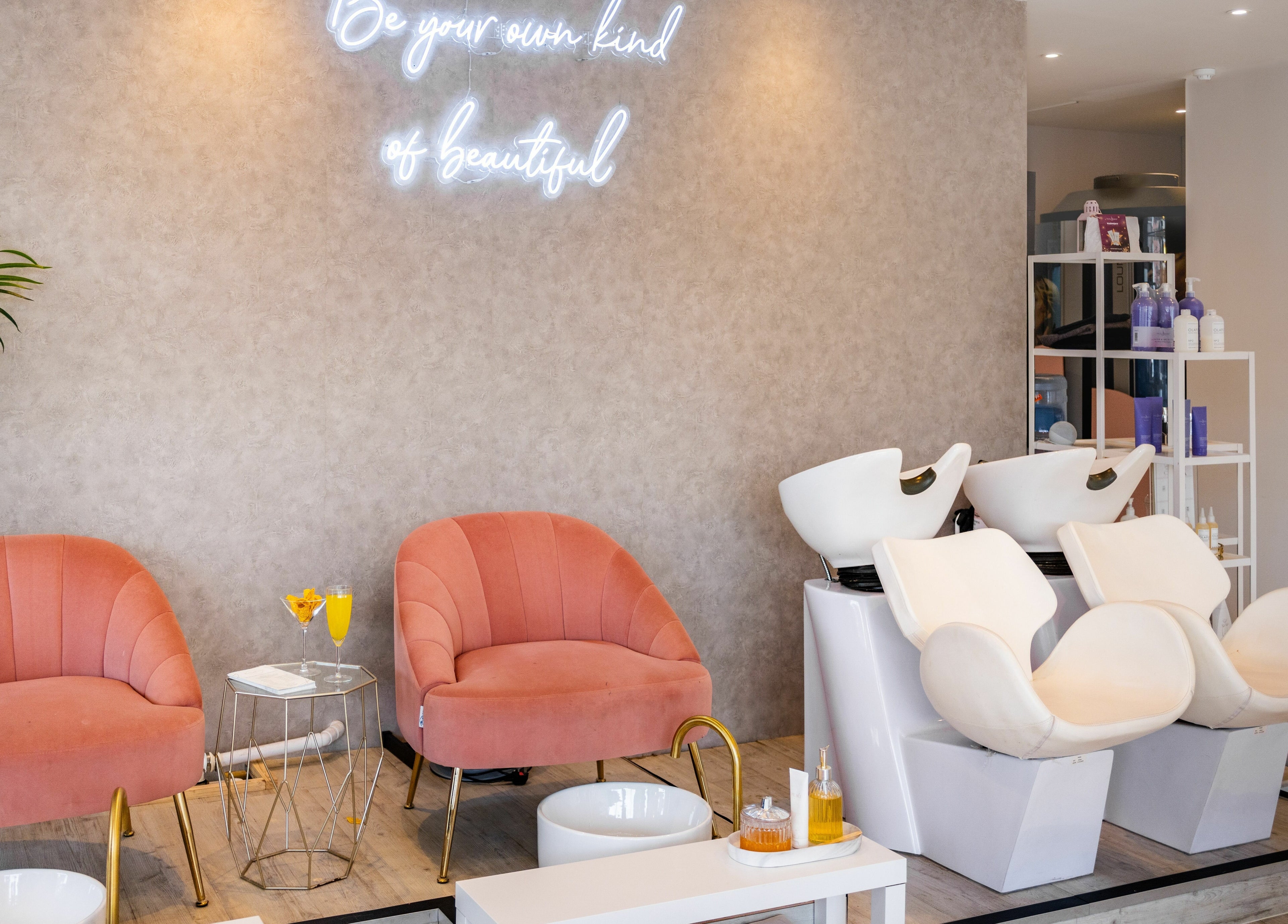 Elegant salon setup at Pamper Parties - Bella Rose in West Wickham, England, GB with plush chairs and hair wash stations.