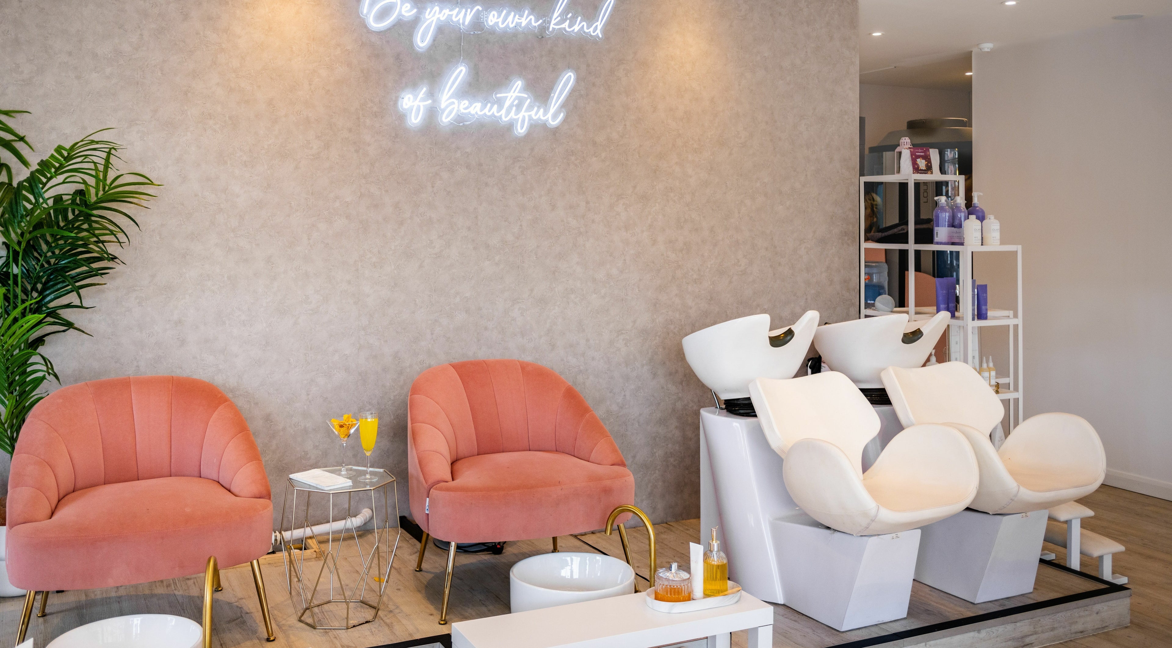 Elegant salon setup at Pamper Parties - Bella Rose in West Wickham, England, GB with plush chairs and hair wash stations.