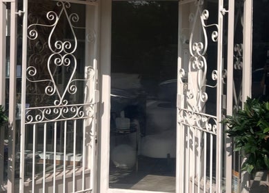Elegant entrance with ornate iron gates at H A Beauty & Aesthetics within The Hair Extension Shop, West Wickham, England, GB.