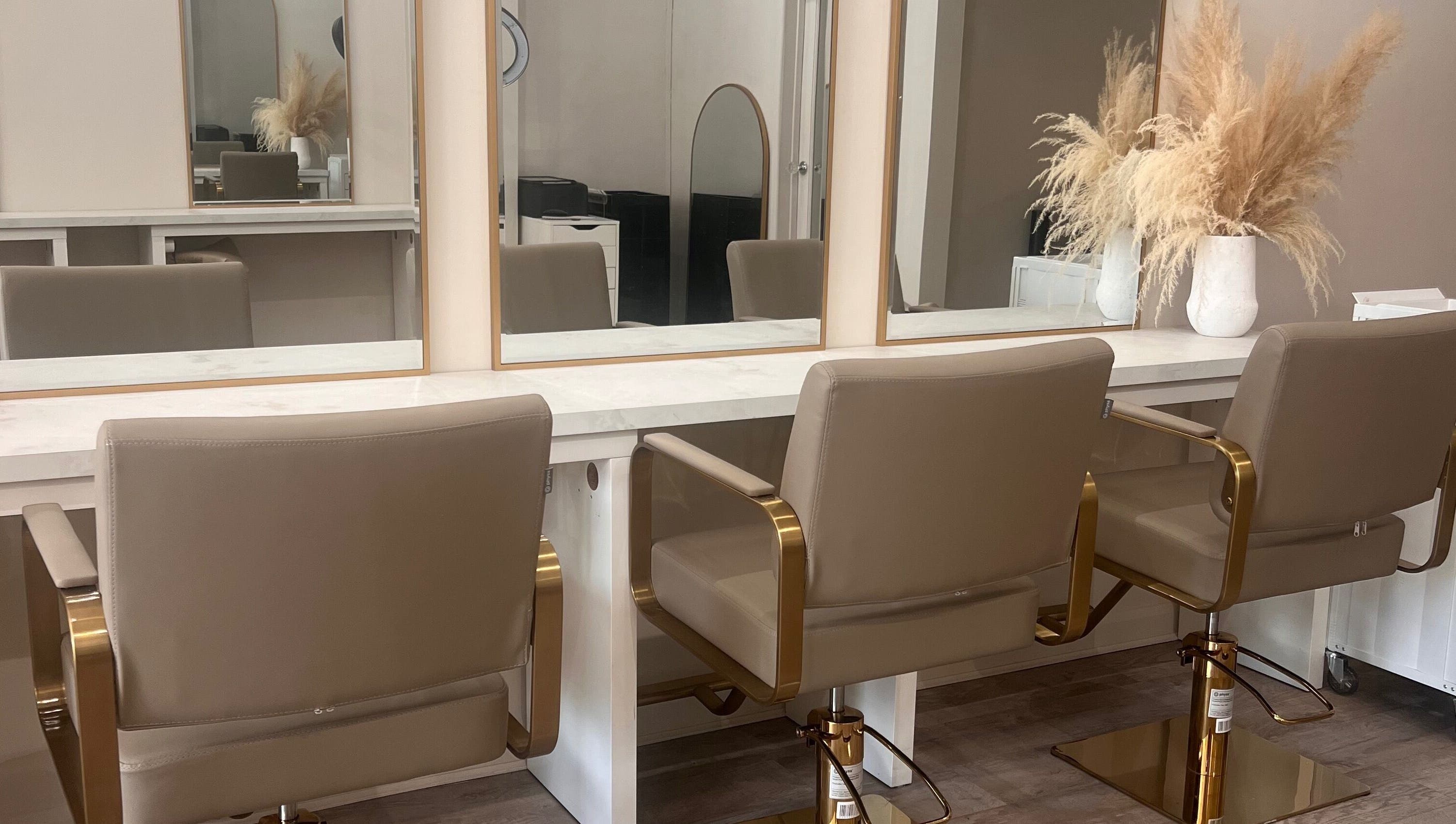 Elegant salon setup at The Hair Extension Shop, West Wickham, England, GB, featuring stylish chairs and mirrors.