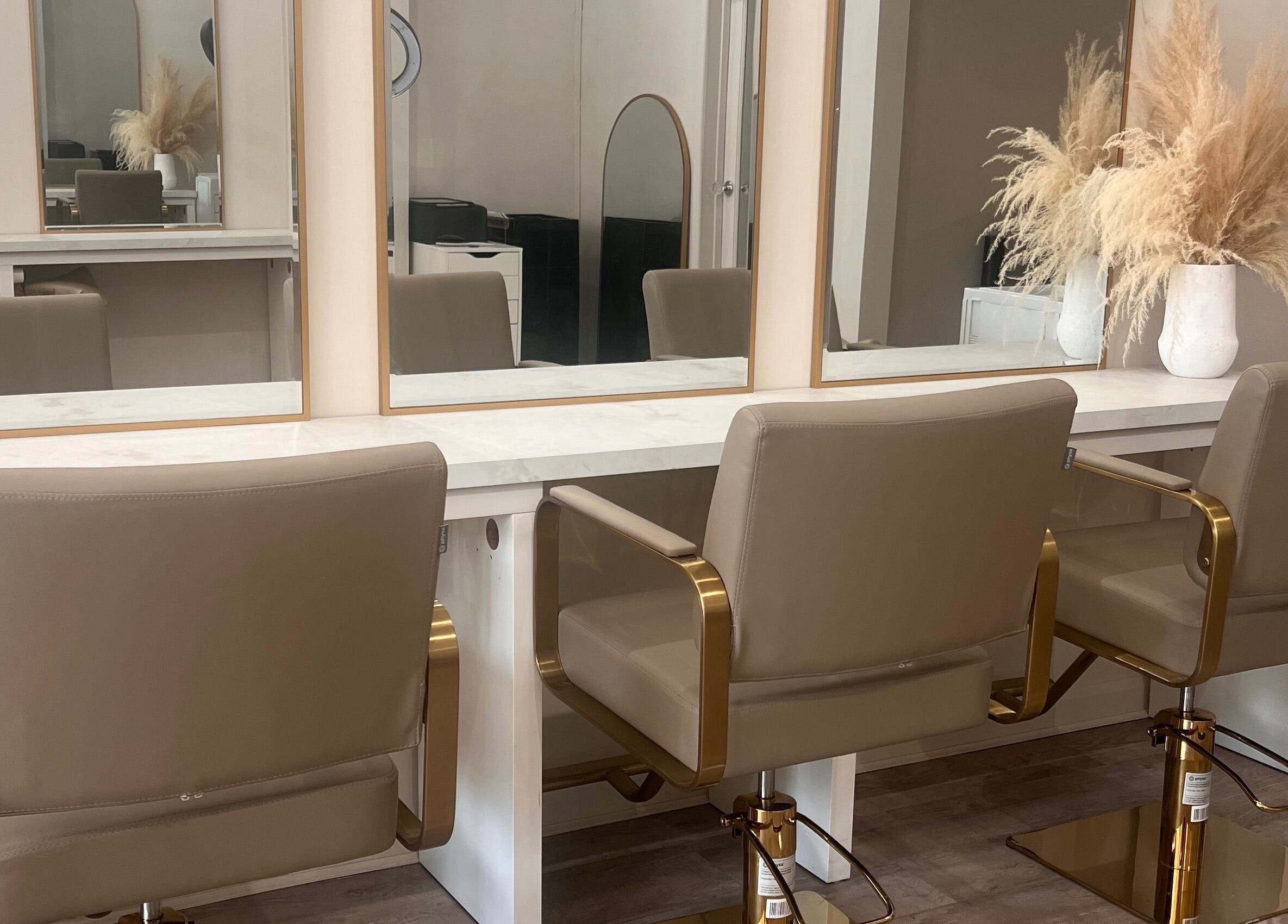 Elegant salon setup at The Hair Extension Shop, West Wickham, England, GB, featuring stylish chairs and mirrors.