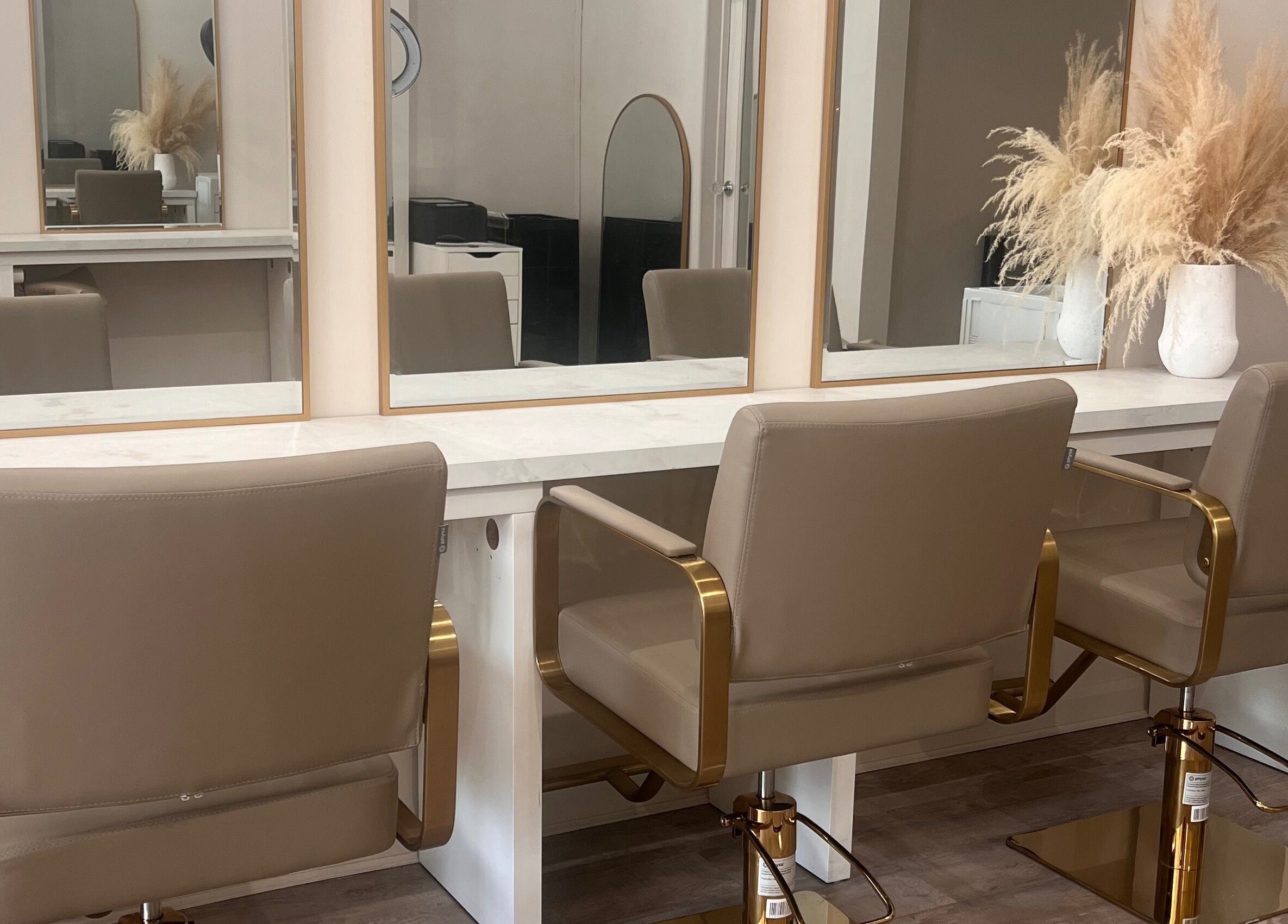 Elegant salon setup at The Hair Extension Shop, West Wickham, England, GB, featuring stylish chairs and mirrors.