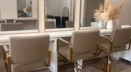 Elegant salon setup at The Hair Extension Shop, West Wickham, England, GB, featuring stylish chairs and mirrors.