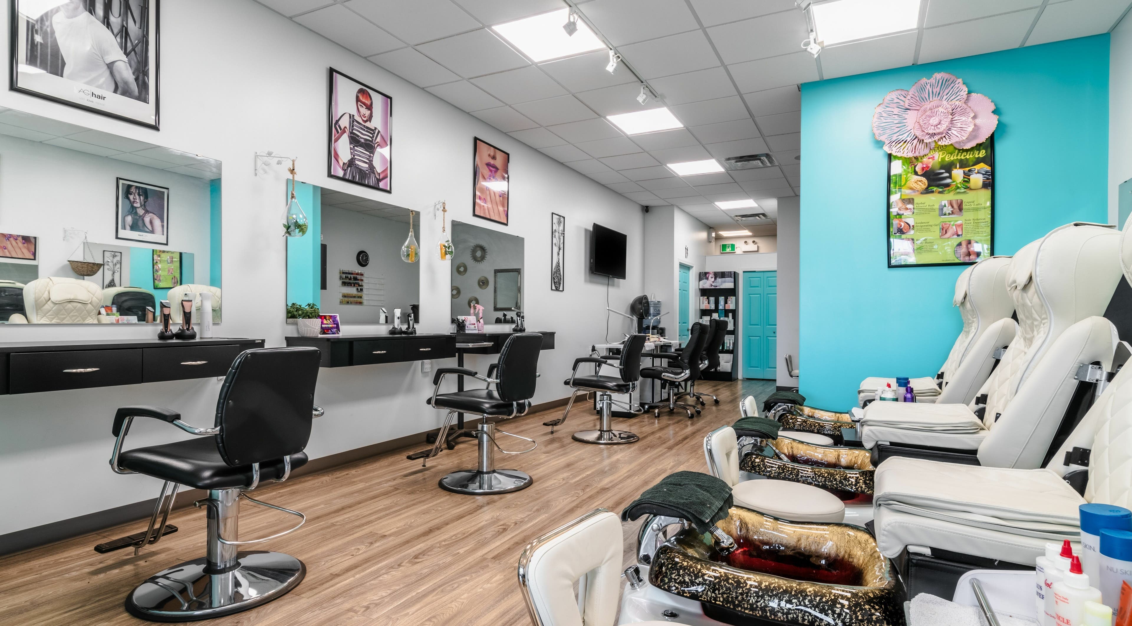 Bright, modern interior of Spring Hair and Nails Salon in Regina, Saskatchewan, CA with chic salon chairs.
