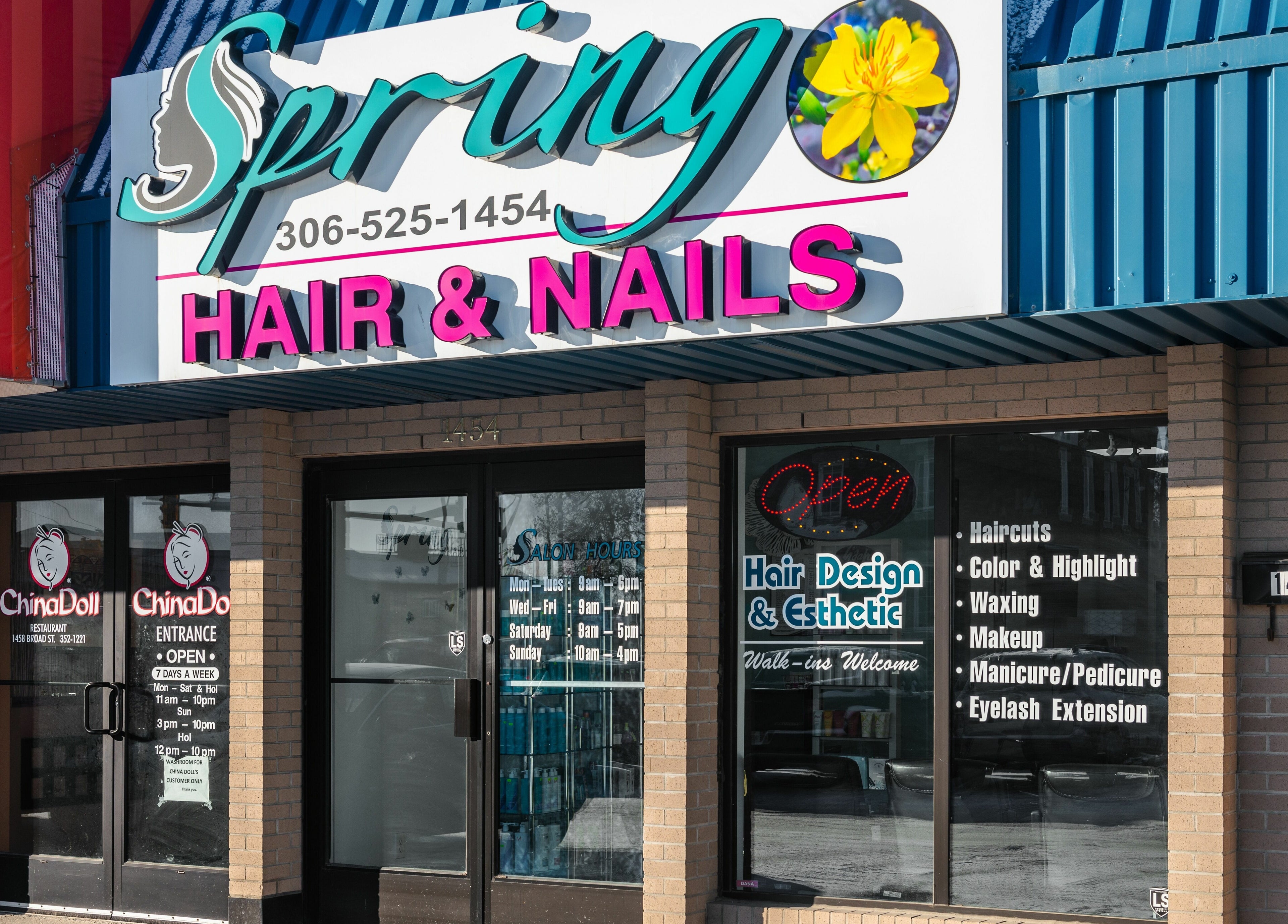 Entrance of Spring Hair and Nails Salon in Regina, Saskatchewan, CA showcasing vibrant signage.