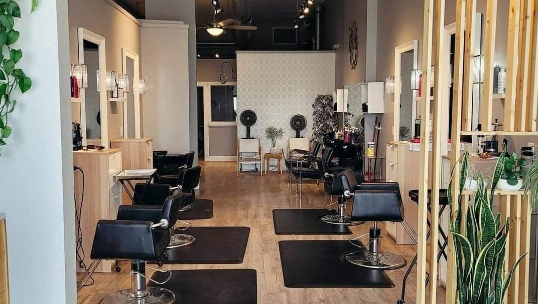 Interior of Hot Shades Salon, Pilot Butte, Saskatchewan, CA with stylish decor and salon chairs.