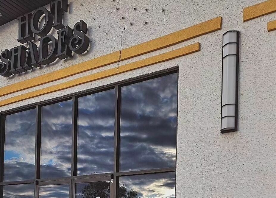Entrance of Hot Shades Salon in Pilot Butte, Saskatchewan, CA with stylish exterior design.