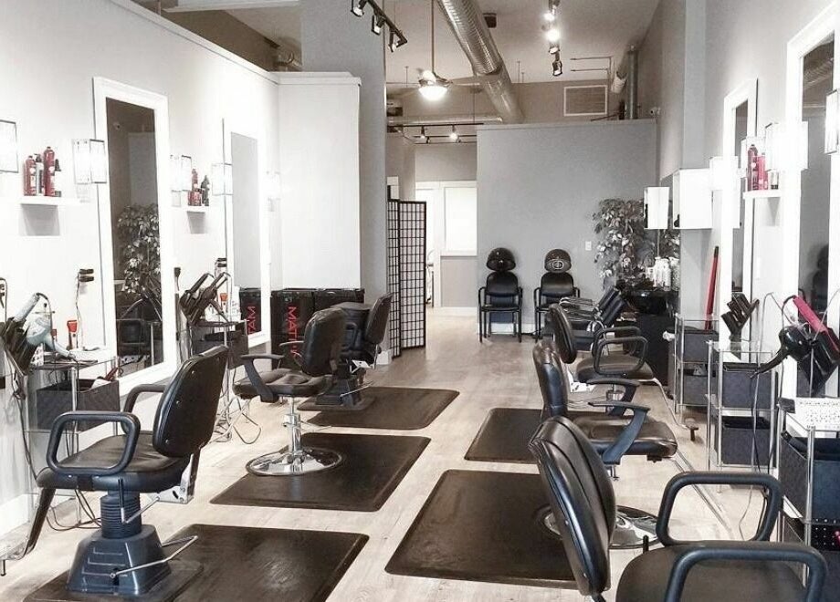 Stylish interior of Hot Shades Salon in Pilot Butte, Saskatchewan, CA, featuring modern salon chairs and mirrors.