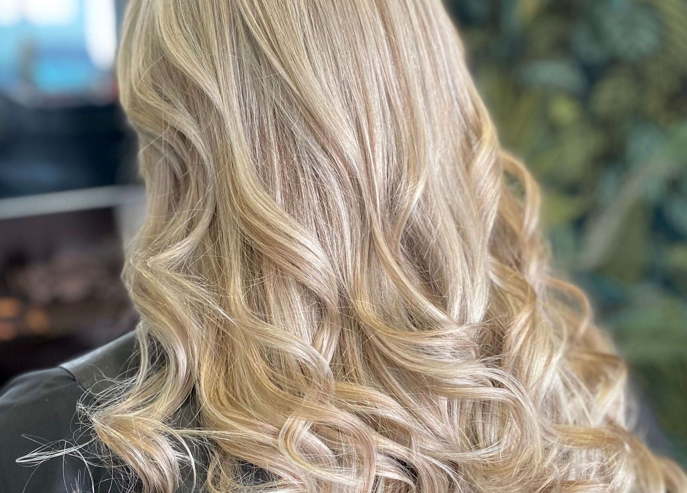 Elegant blonde curls at hairstyles@wetherells, Selby, England, GB. A showcase of hairdressing craftsmanship.