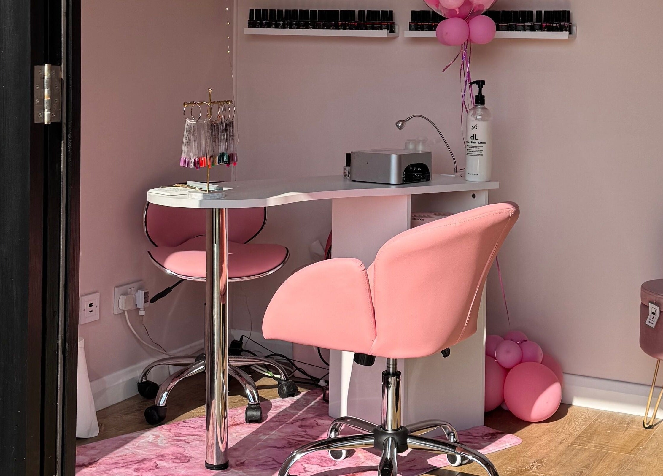 Chic pink manicure station at The Nest, Stoke-on-Trent, England, GB, featuring modern salon equipment.