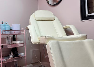 Elegant spa chair and skincare products at The Nest, Stoke-on-Trent, England, GB. A serene wellness space.