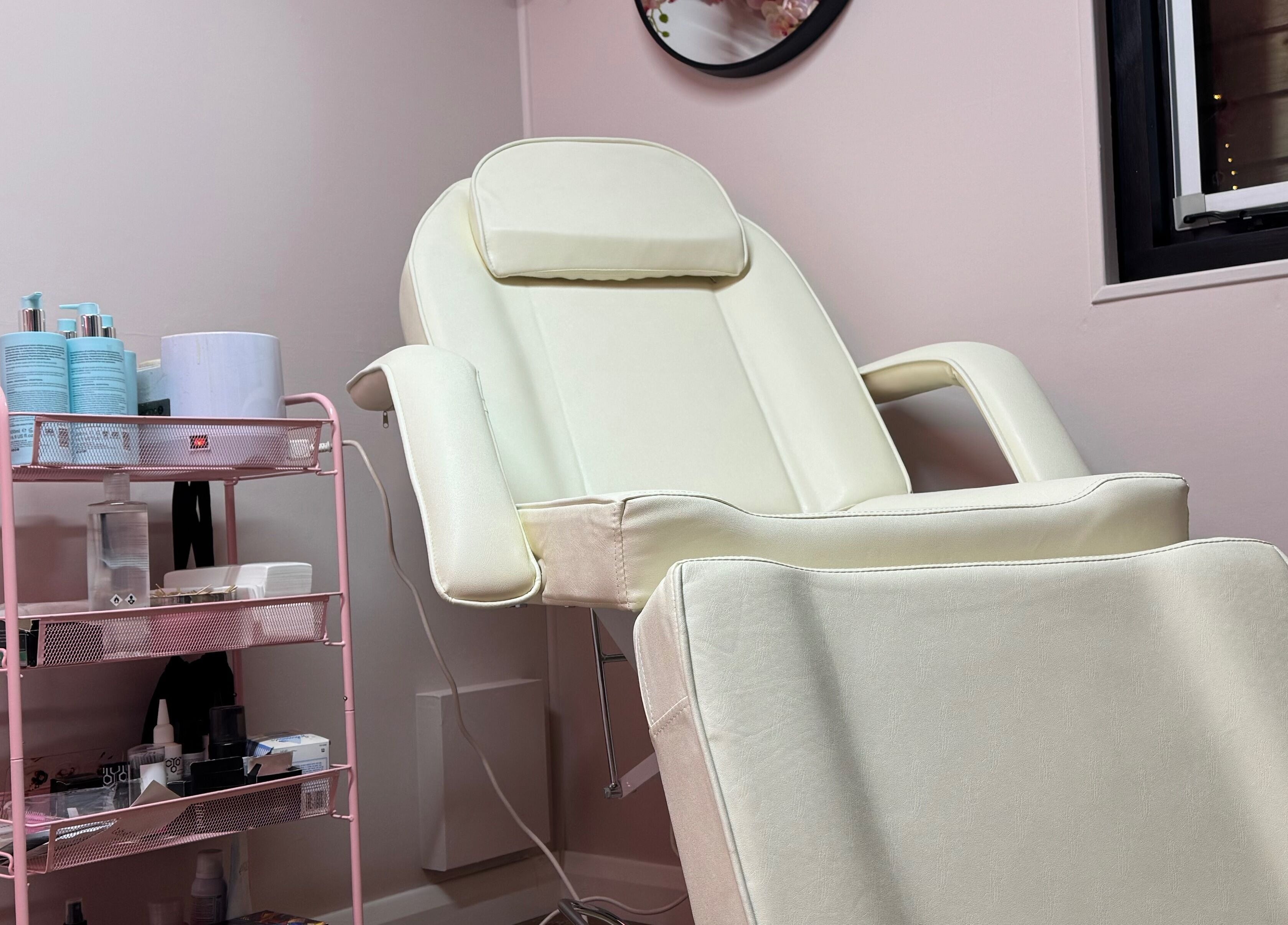 Elegant spa chair and skincare products at The Nest, Stoke-on-Trent, England, GB. A serene wellness space.