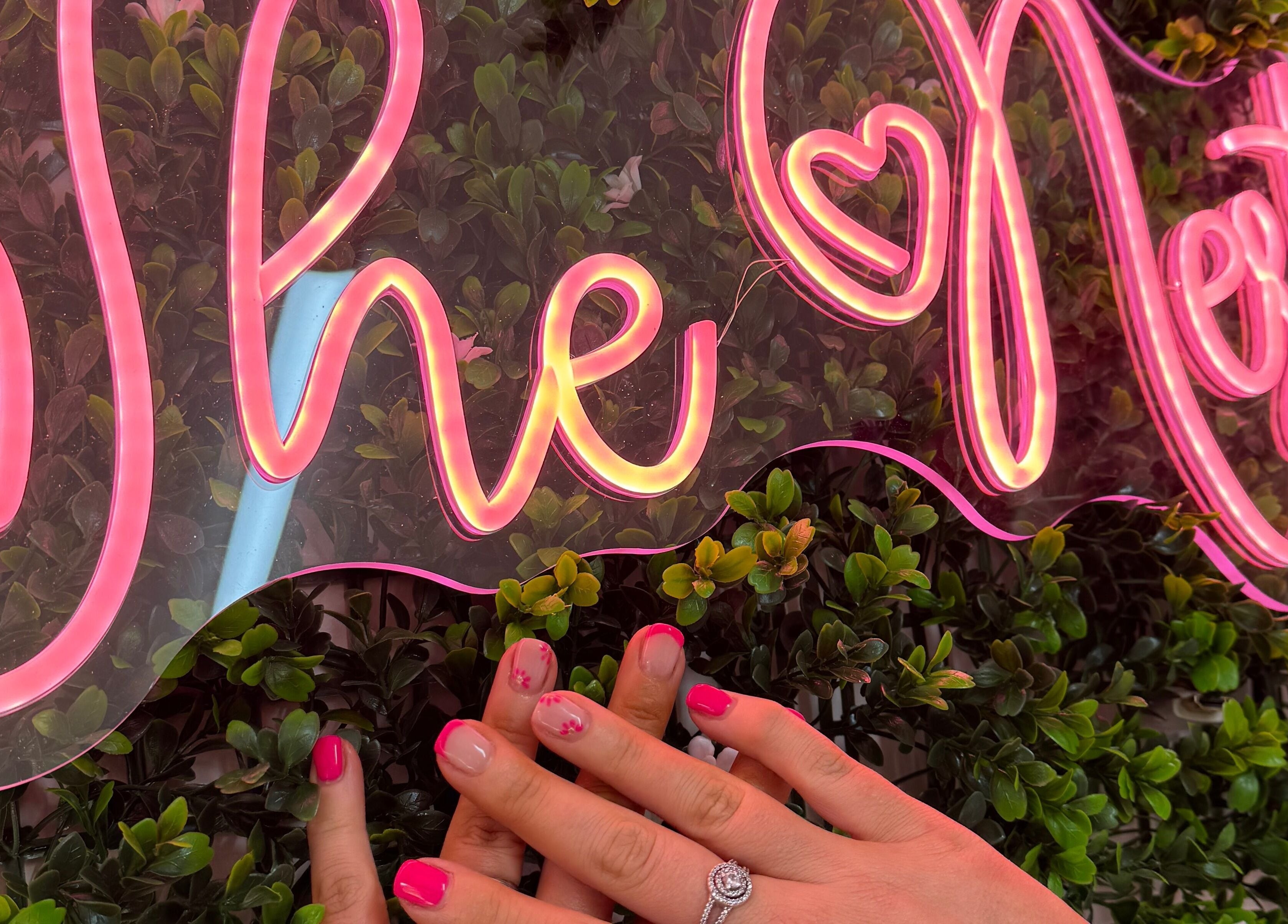 Neon sign at The Nest, Stoke-on-Trent, England, GB, with pink manicured nails.