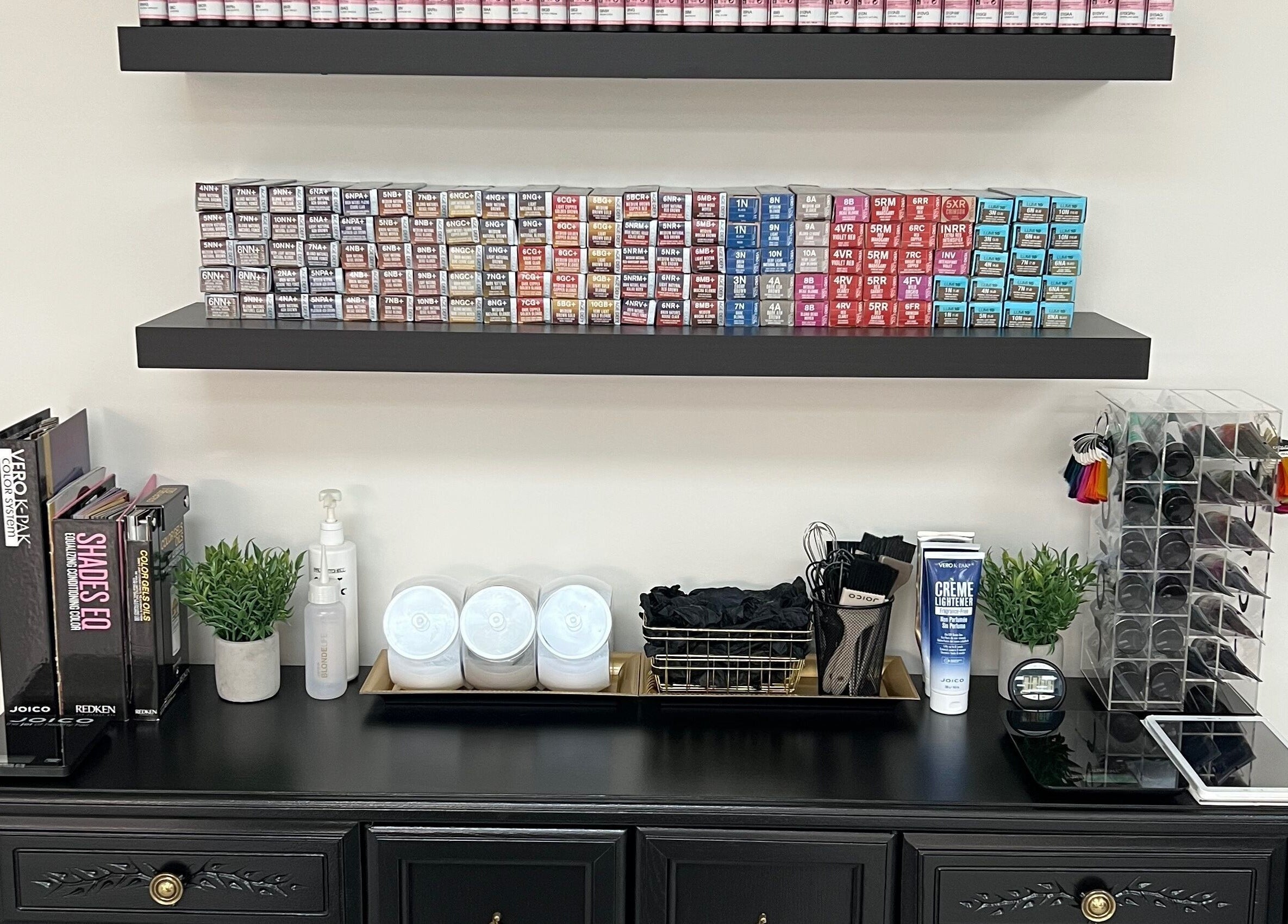 Hair color and salon products organized on shelves at Impressions Salon - Saskatoon, Saskatchewan, CA.