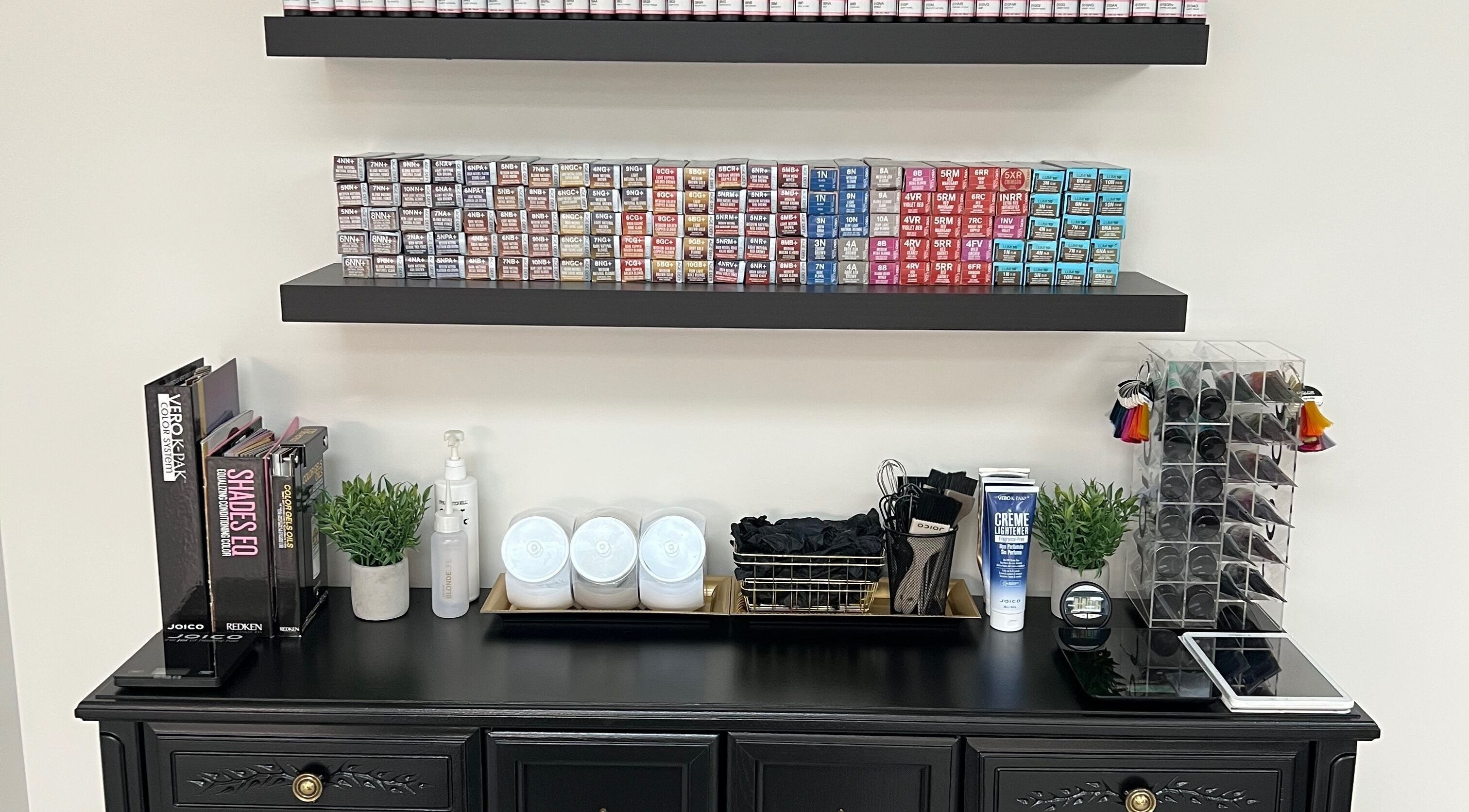 Hair color and salon products organized on shelves at Impressions Salon - Saskatoon, Saskatchewan, CA.
