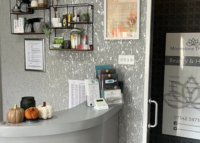 Reception at Moonstone Therapies in Brighouse, England, GB with serene decor and beauty service lists.