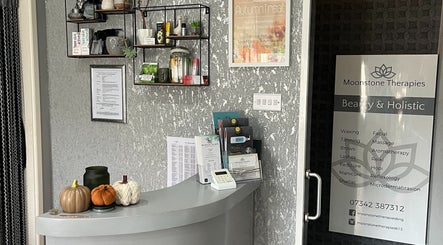 Reception at Moonstone Therapies in Brighouse, England, GB with serene decor and beauty service lists.