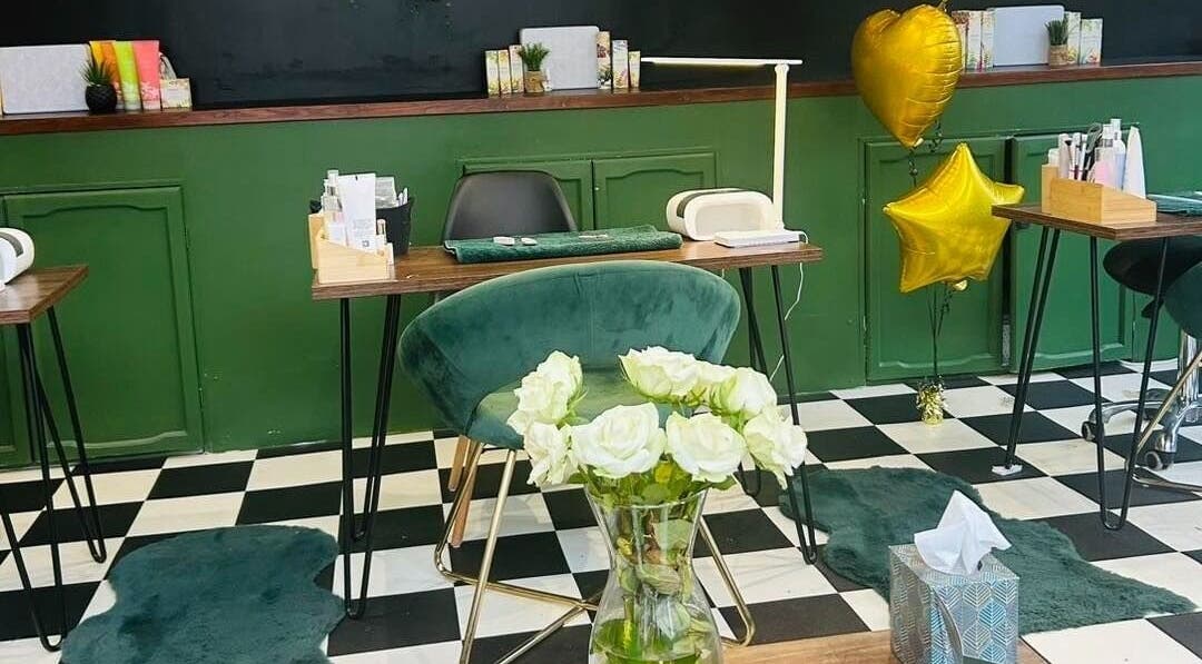 Elegant beauty station at Station Beauty, Whitehill, England, GB with green decor and balloons.
