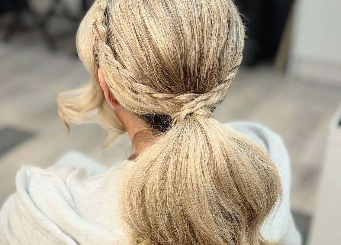 Elegant braided hairstyle at By Rayner salon, Warrington, GB, showcasing stylish and sophisticated hair design.