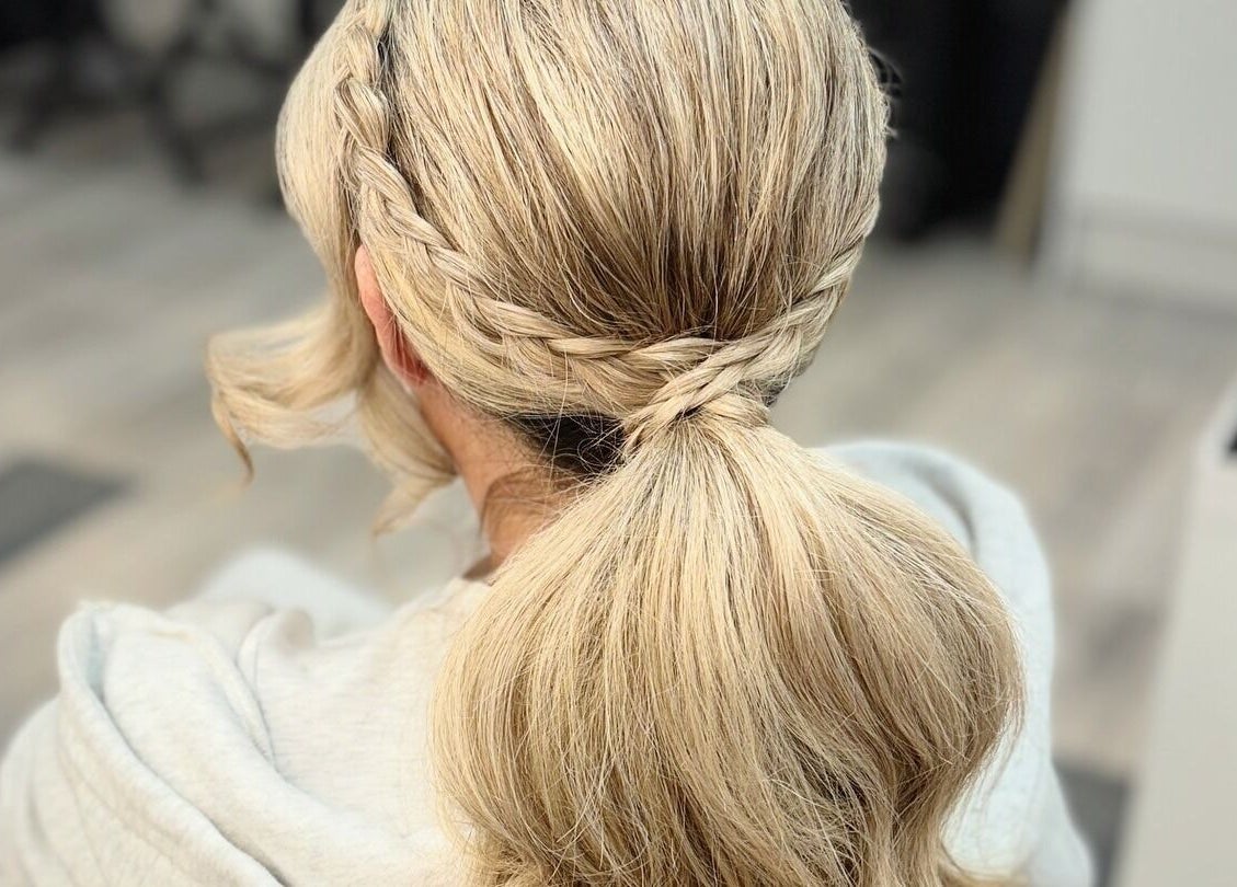 Elegant braided hairstyle at By Rayner salon, Warrington, GB, showcasing stylish and sophisticated hair design.