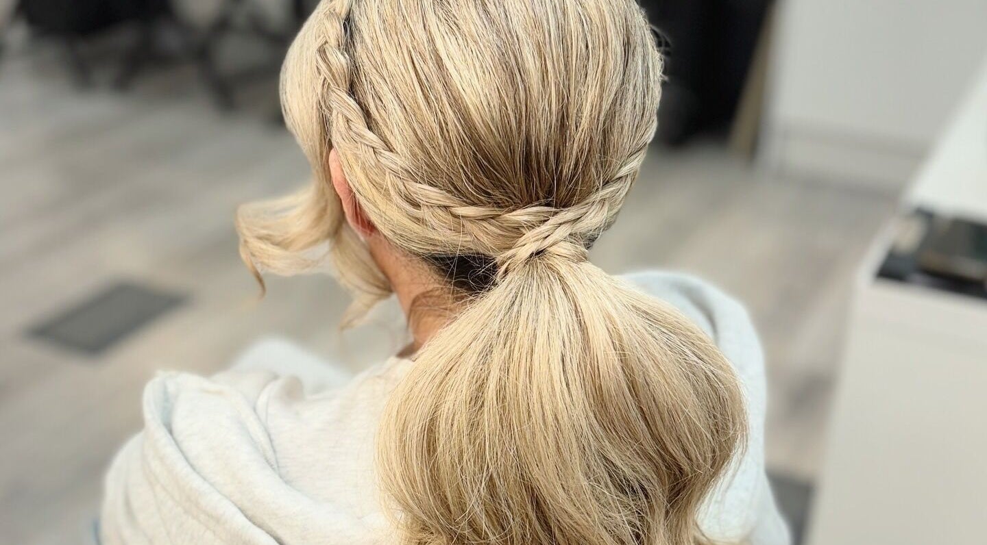 Elegant braided hairstyle at By Rayner salon, Warrington, GB, showcasing stylish and sophisticated hair design.