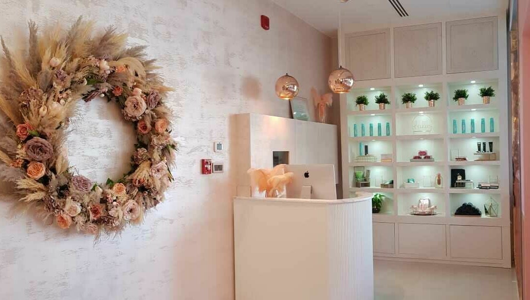 Reception area at Twiink Studio in Abu Dhabi, AE, showcasing chic decor and a serene ambiance.