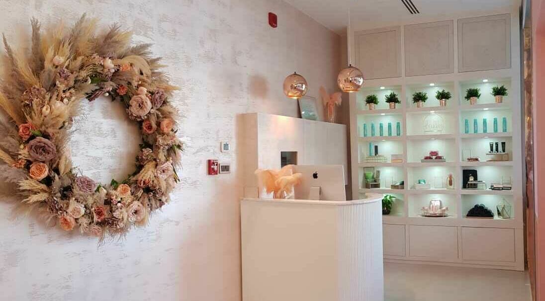 Reception area at Twiink Studio in Abu Dhabi, AE, showcasing chic decor and a serene ambiance.