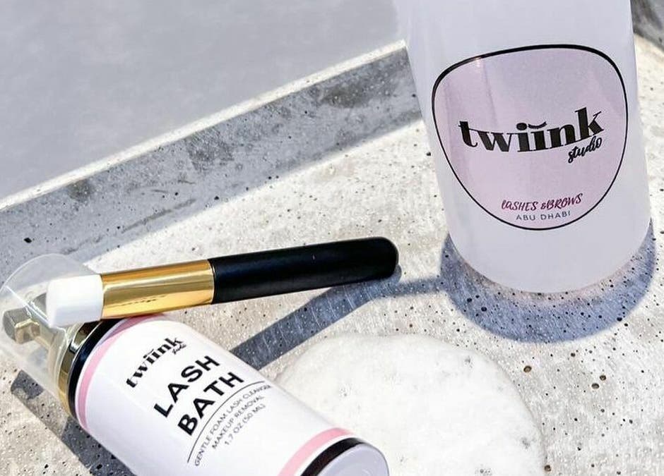 Lash Bath and brush from Twiink Studio, Abu Dhabi, AE displayed elegantly on concrete surface.