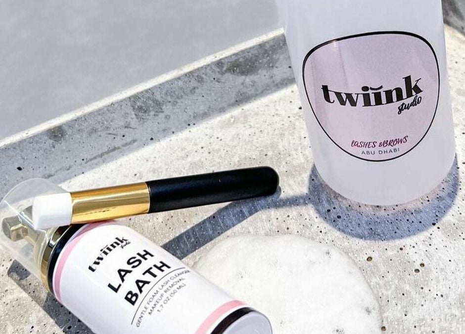 Lash Bath and brush from Twiink Studio, Abu Dhabi, AE displayed elegantly on concrete surface.
