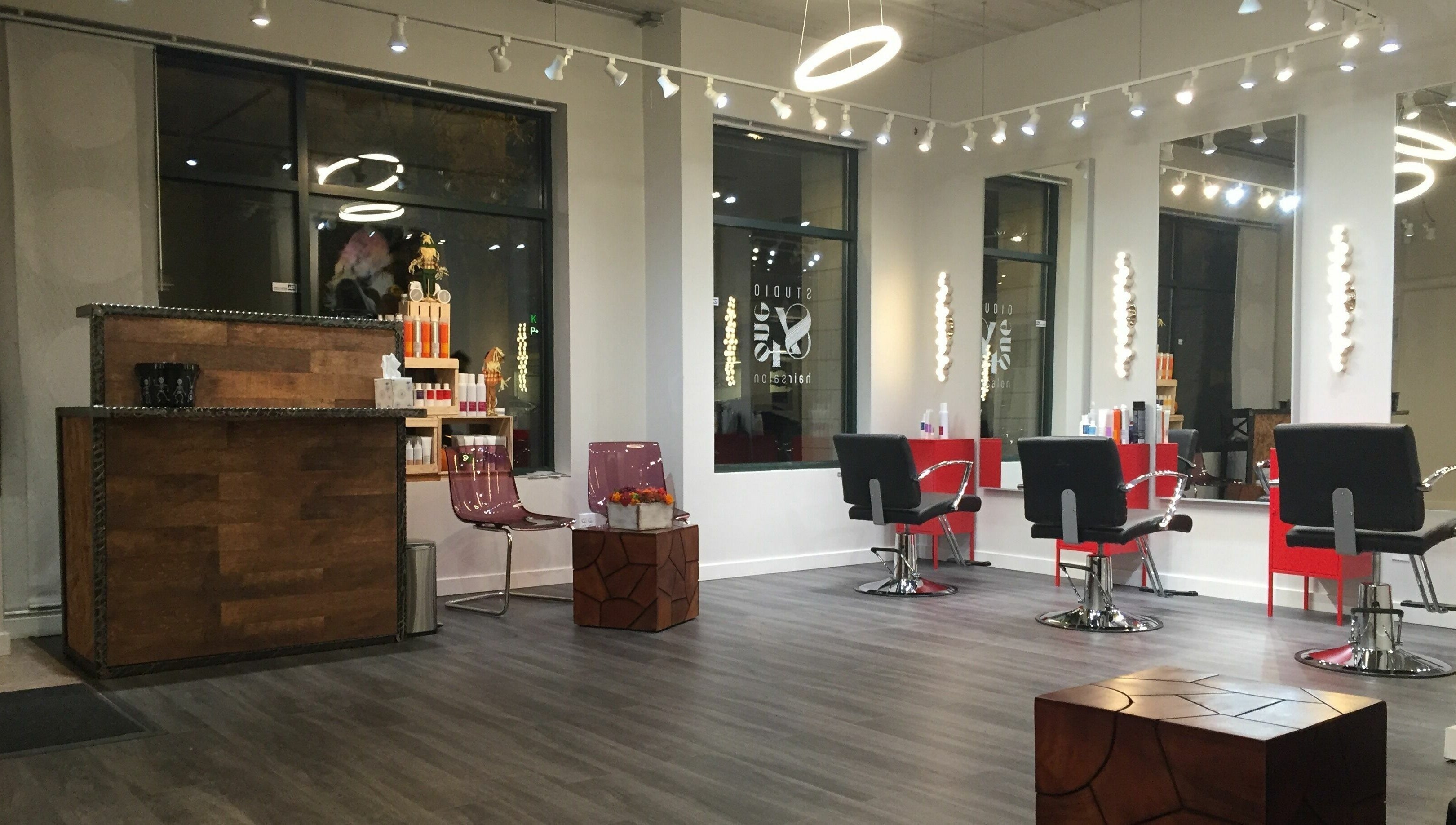Modern interior of Studio 84one in Chicago, Illinois, US with sleek salon chairs and stylish decor.