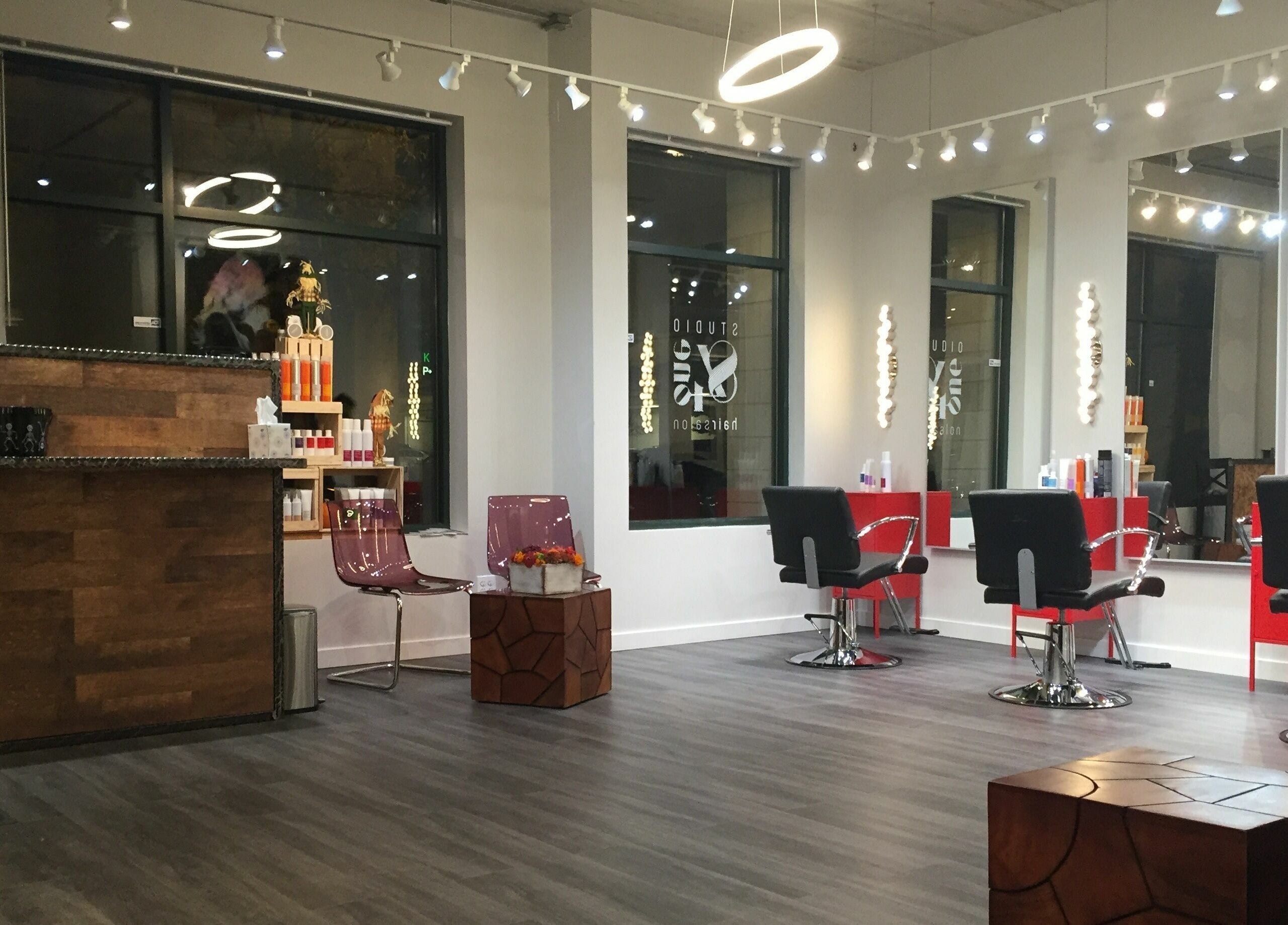 Modern interior of Studio 84one in Chicago, Illinois, US with sleek salon chairs and stylish decor.