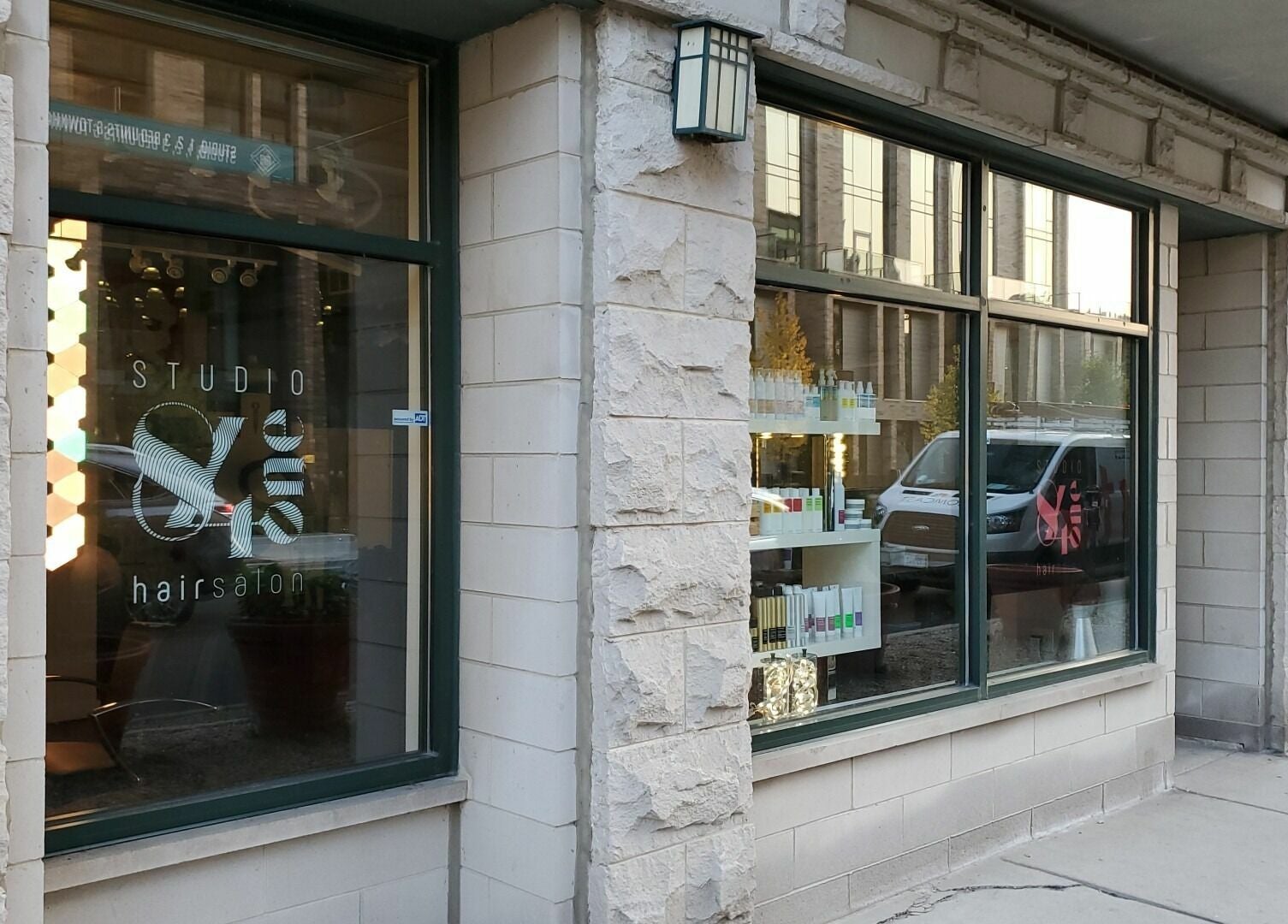 Exterior view of Studio 84one, a trendy hair salon in Chicago, Illinois, US with stylish stone facade.
