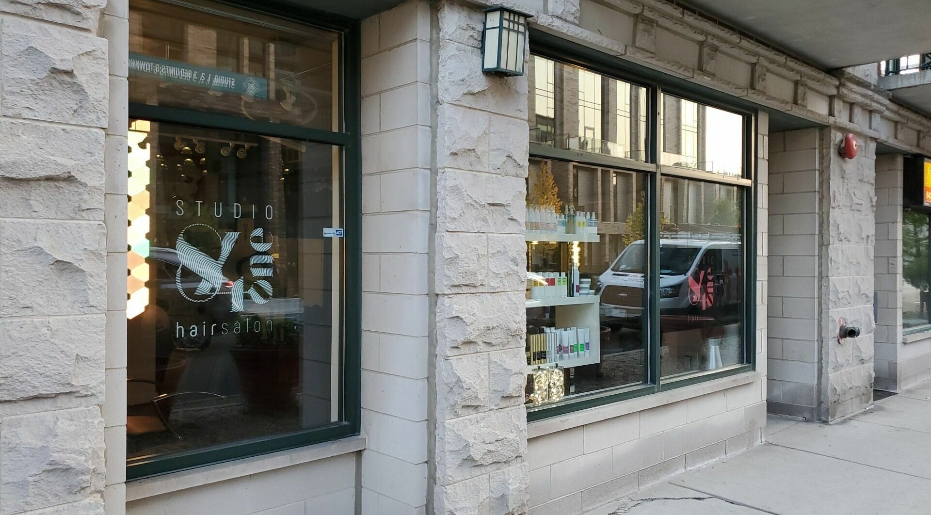 Exterior view of Studio 84one, a trendy hair salon in Chicago, Illinois, US with stylish stone facade.