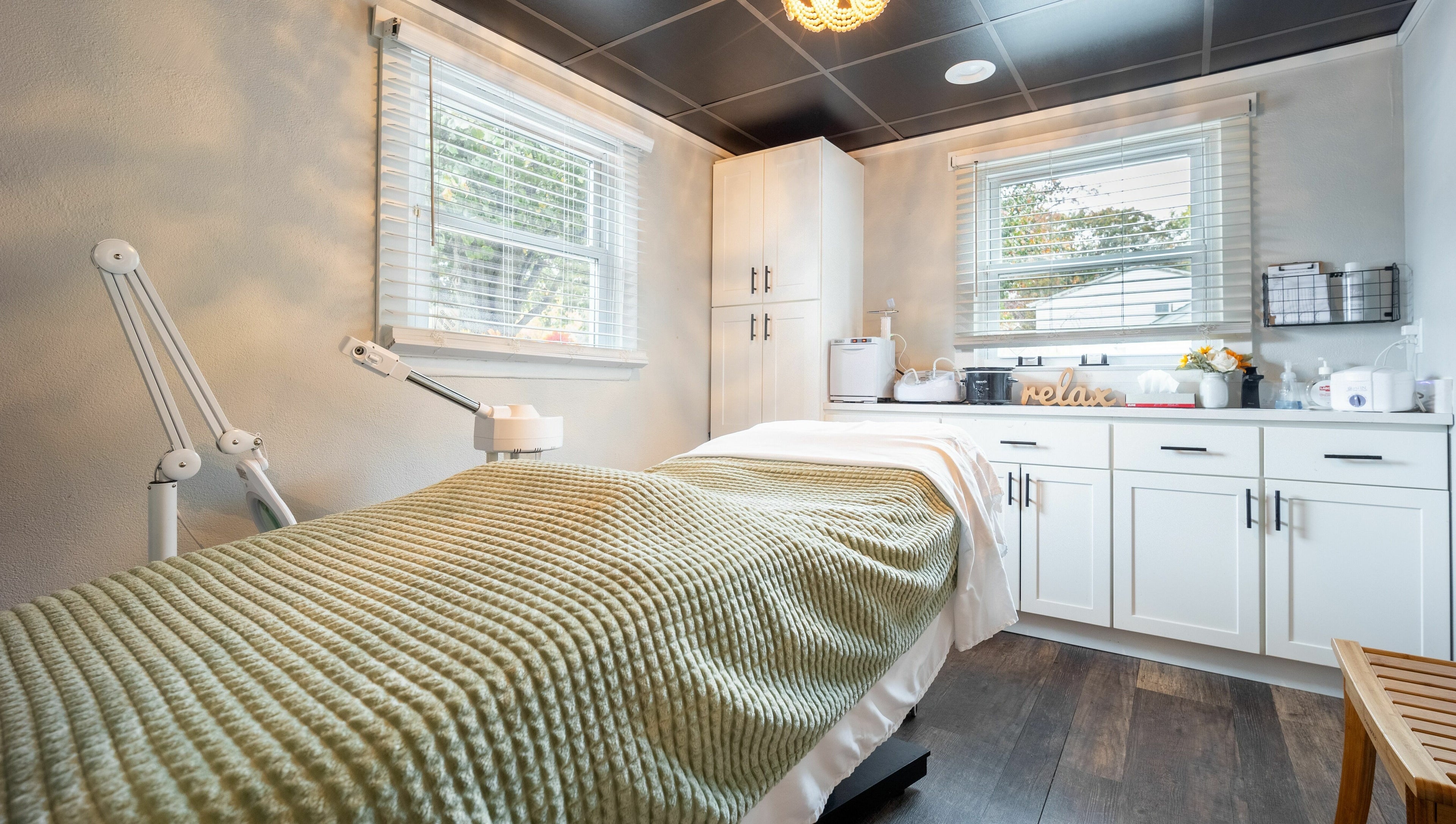 Tranquil treatment room at Simply Fresh Aesthetics in Miller Place, New York, US featuring cozy decor.