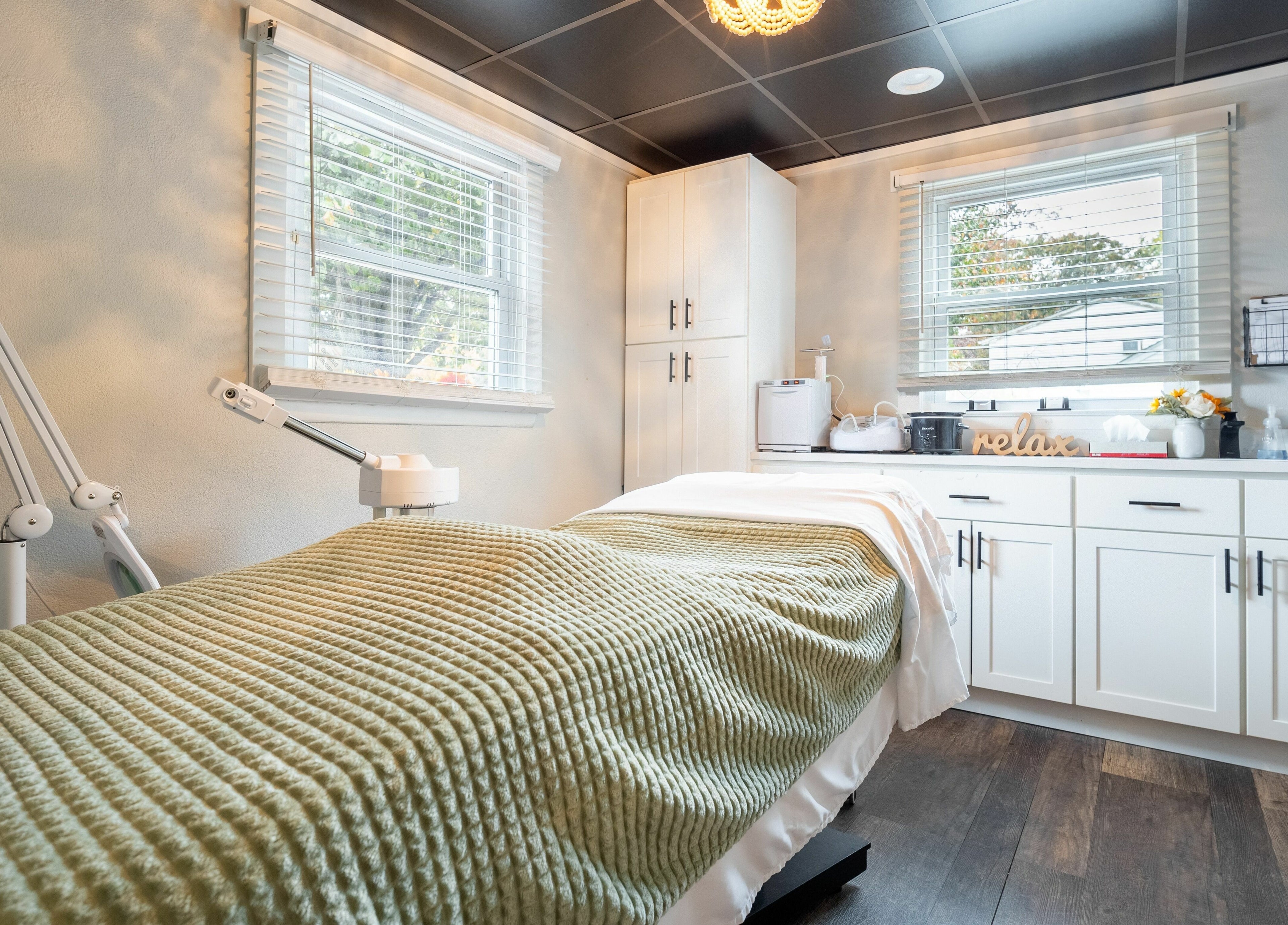 Tranquil treatment room at Simply Fresh Aesthetics in Miller Place, New York, US featuring cozy decor.