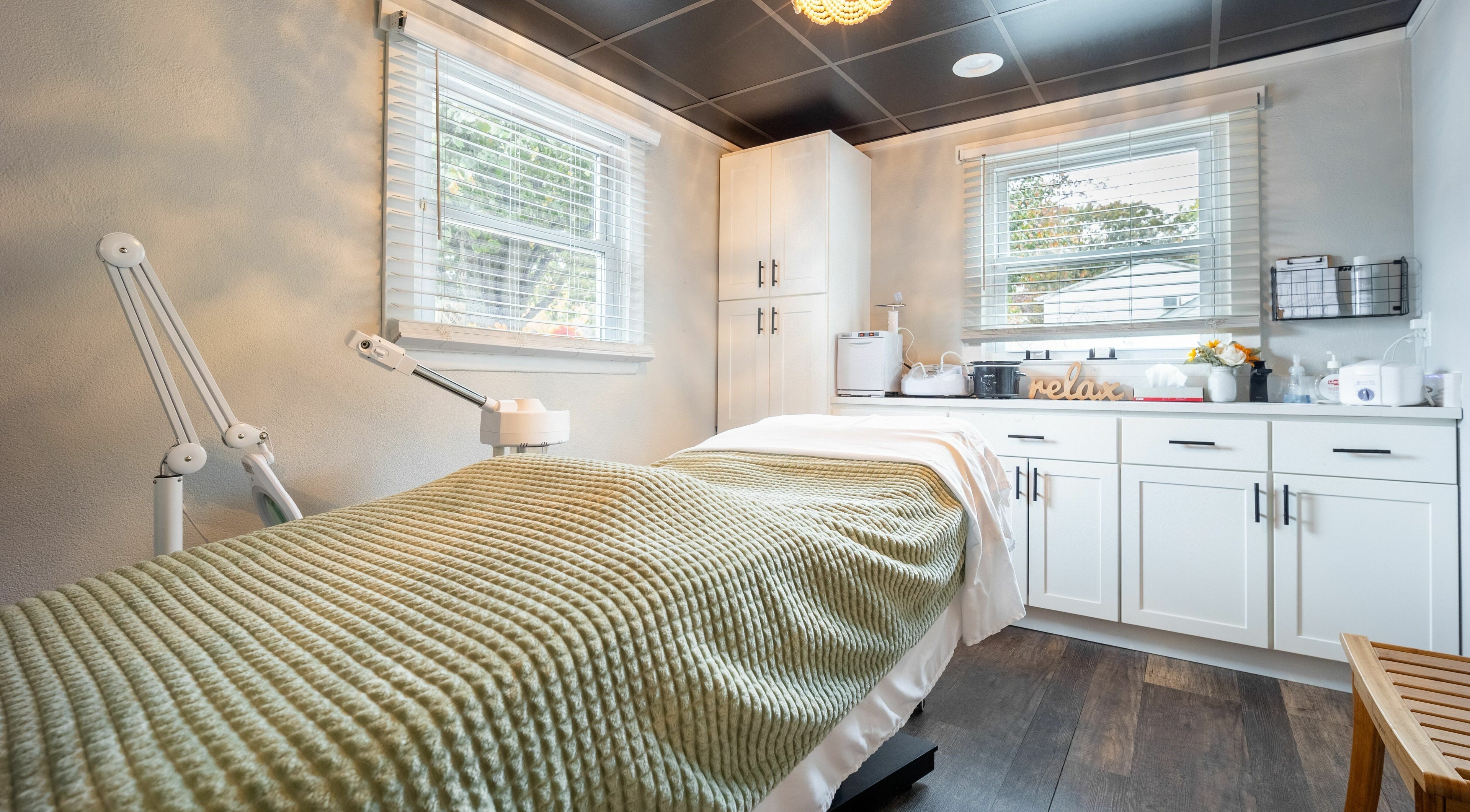 Tranquil treatment room at Simply Fresh Aesthetics in Miller Place, New York, US featuring cozy decor.