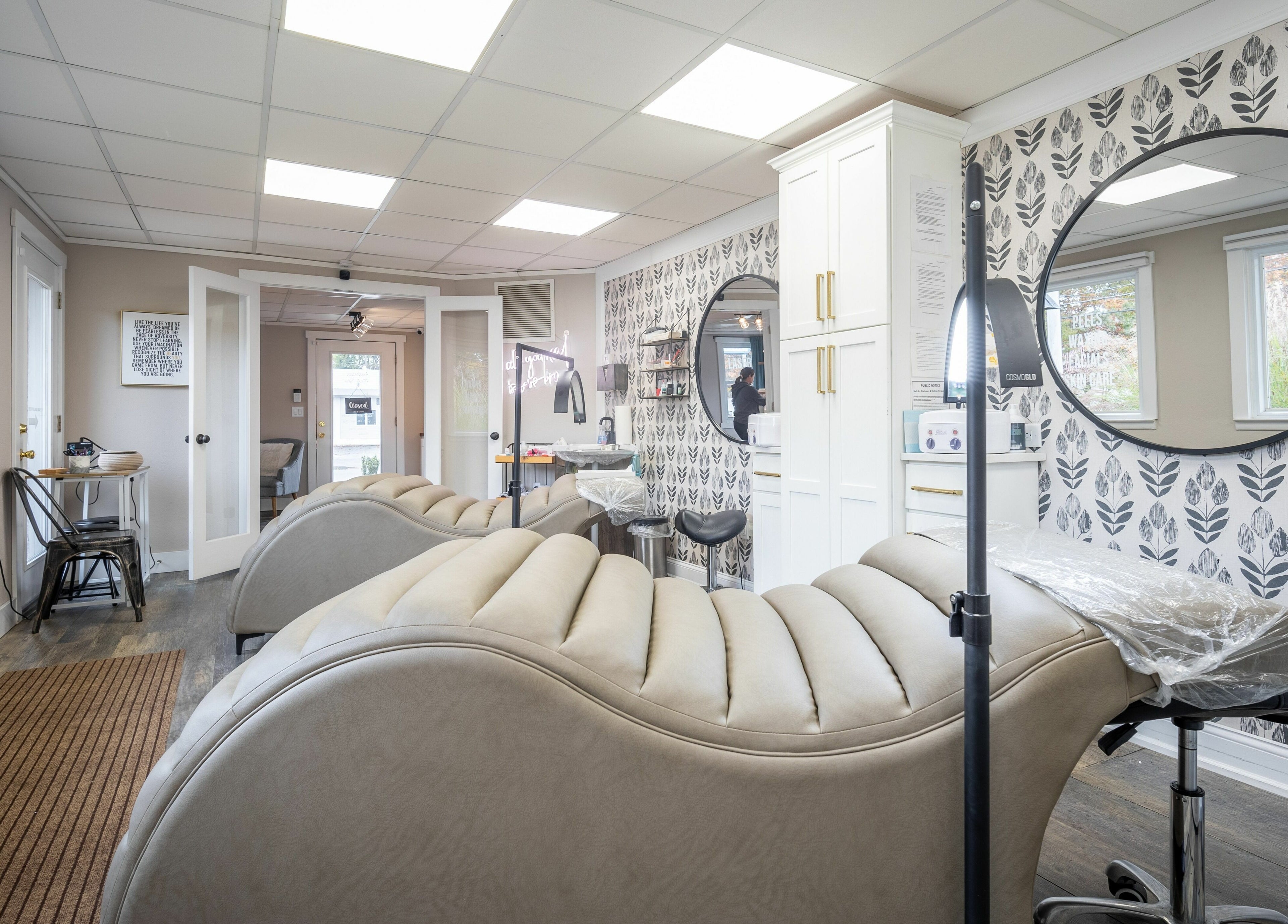 Luxurious treatment room at Simply Fresh Aesthetics in Miller Place, New York, US with modern decor and seating.