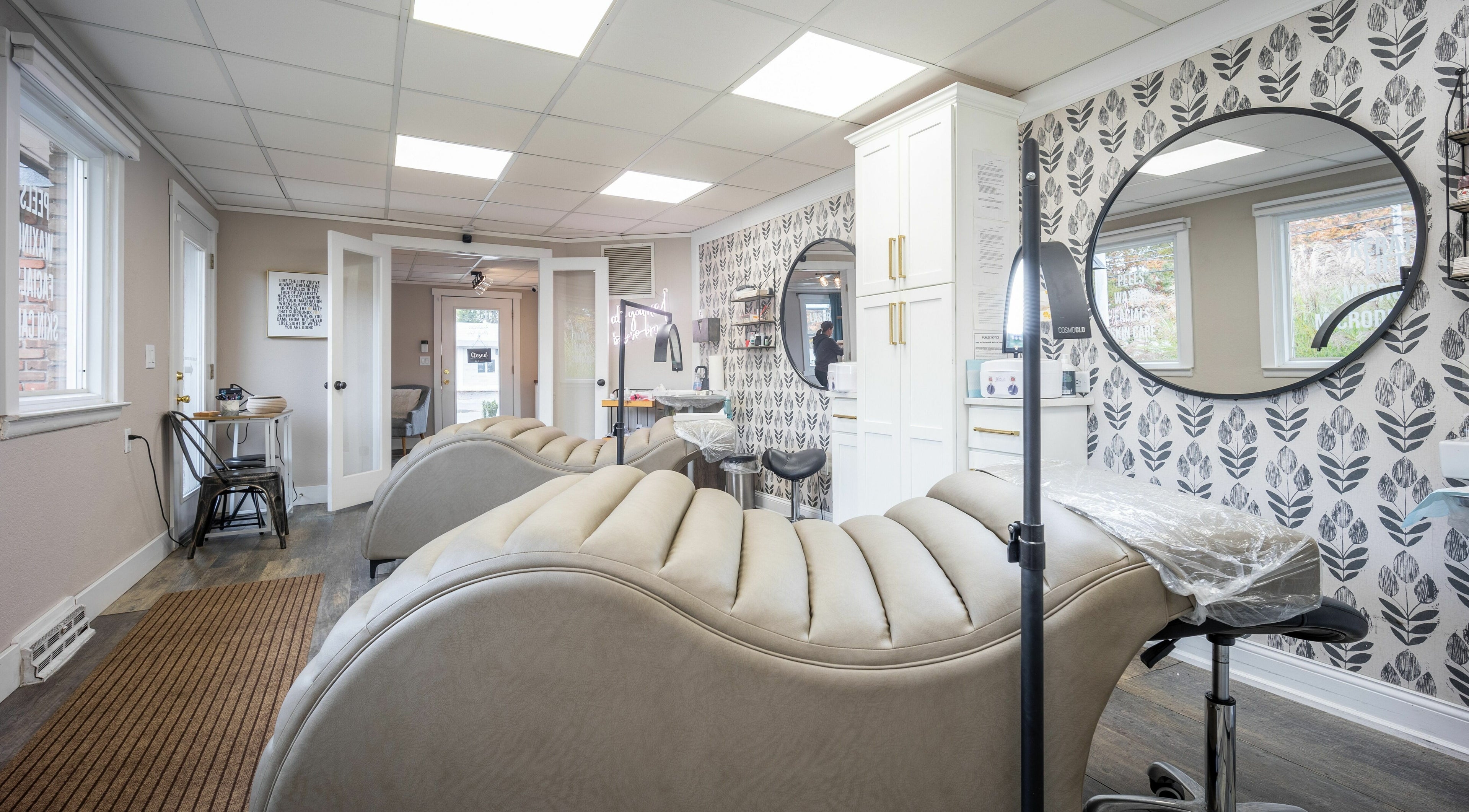 Luxurious treatment room at Simply Fresh Aesthetics in Miller Place, New York, US with modern decor and seating.