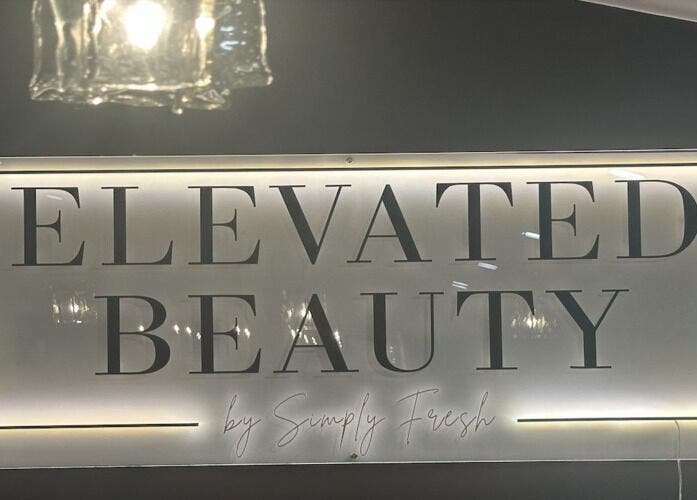 Illuminated sign of Elevated Beauty by SFA at Miller Place, New York, US in a sleek style.