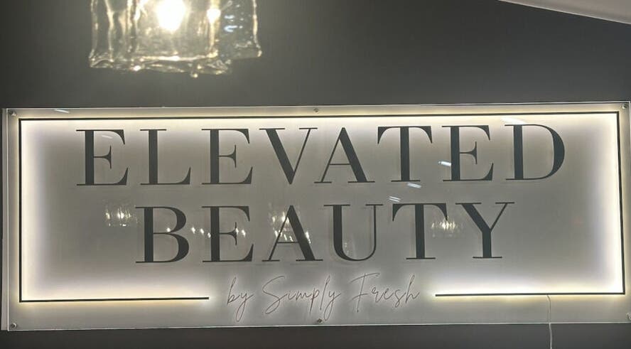Illuminated sign of Elevated Beauty by SFA at Miller Place, New York, US in a sleek style.