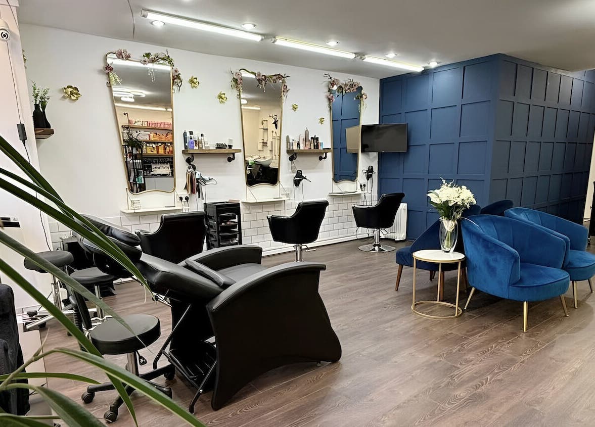 Interior of David Brown Hairdressing and Aesthetics in Northampton, England, GB, featuring stylish seating.