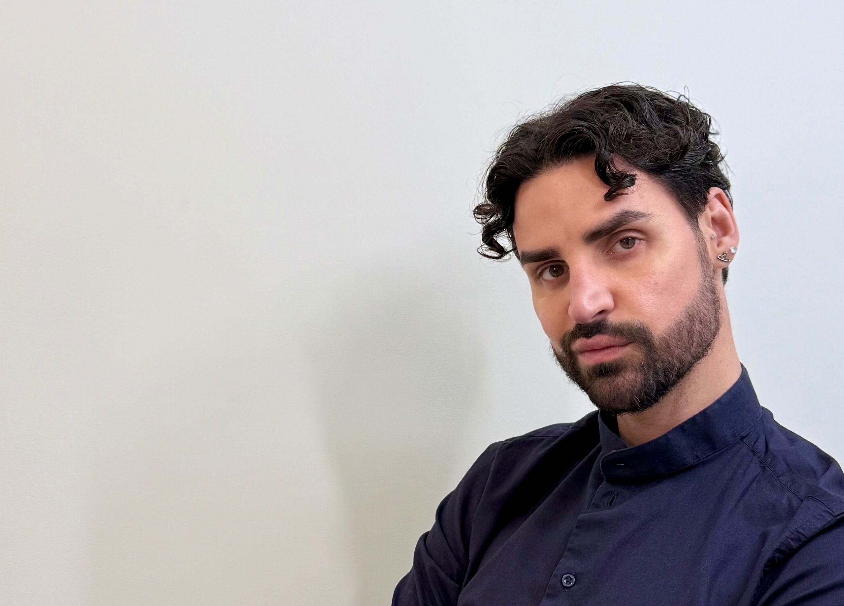 Guest at David Brown Hairdressing and Aesthetics in Northampton, England, GB with stylish hair and confident gaze.