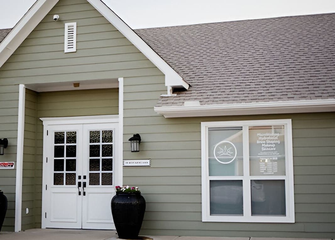 Elegant entrance of The Brow Shaping Queen in Frisco, Texas, US, showcasing modern exterior design.